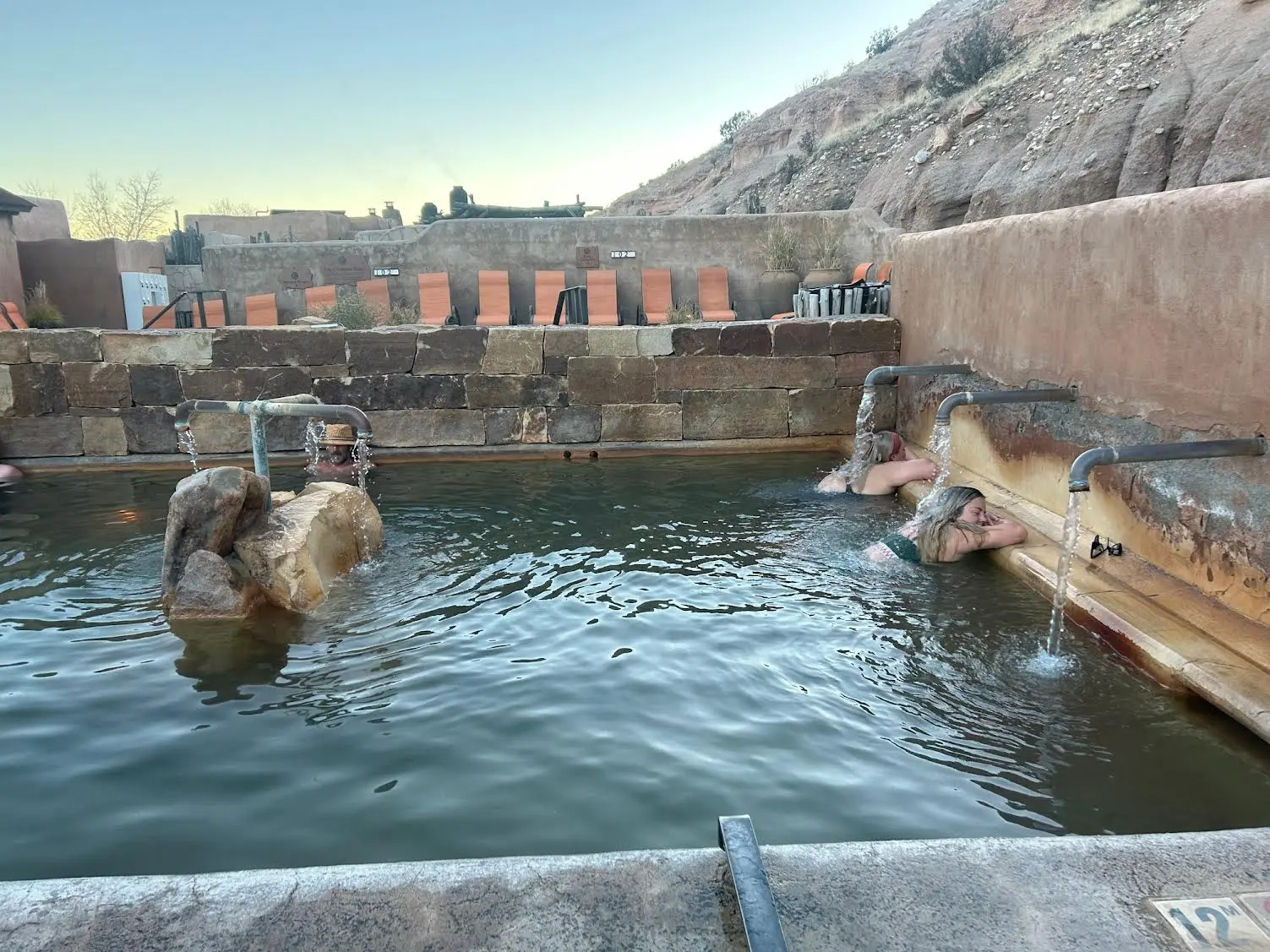 Litha pool at ojo with vistors relaxing in the healing waters