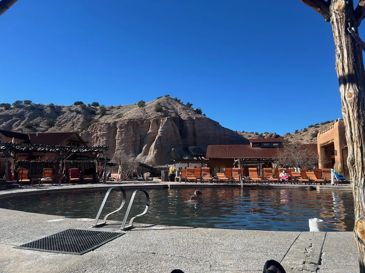 The main pool at the resort with moutain sceneray inthe background