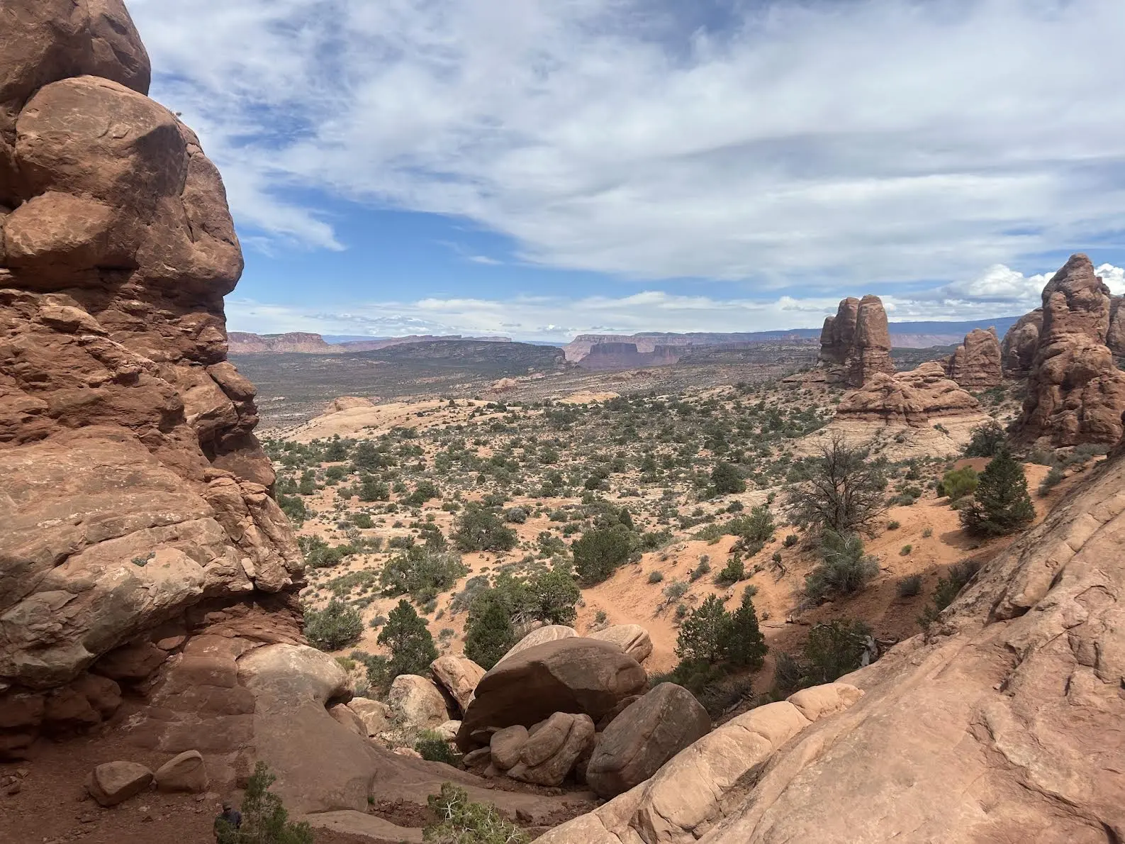 View of the desert with unique rock formations towering in the distance