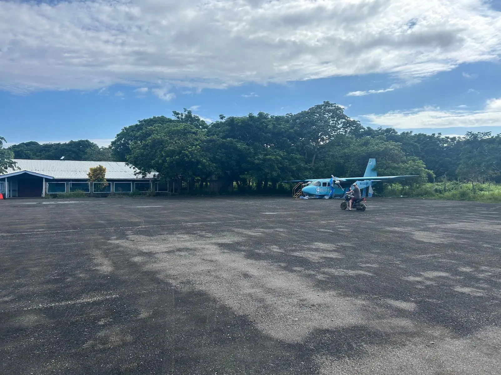 View of the airport runway with my friend in the distance